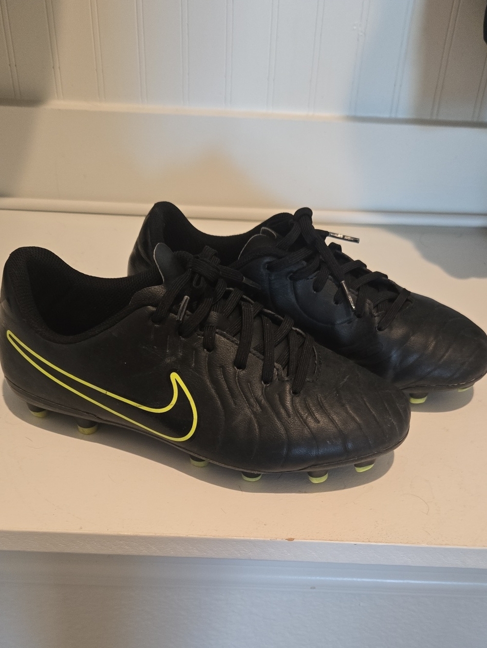 Nike Kids’s Black Soccer Cleats with Neon Yellow Swoosh